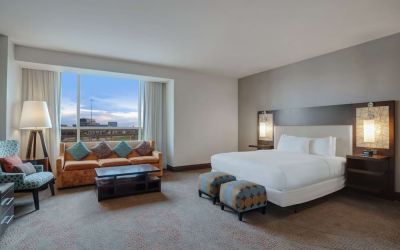 Spacious meeting room with living area at Hilton Dallas/ Plano Granite Park.

