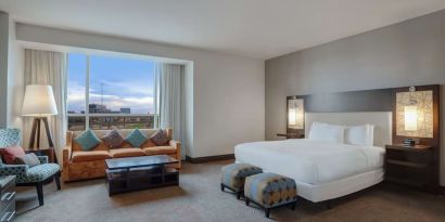 Spacious meeting room with living area at Hilton Dallas/ Plano Granite Park.
