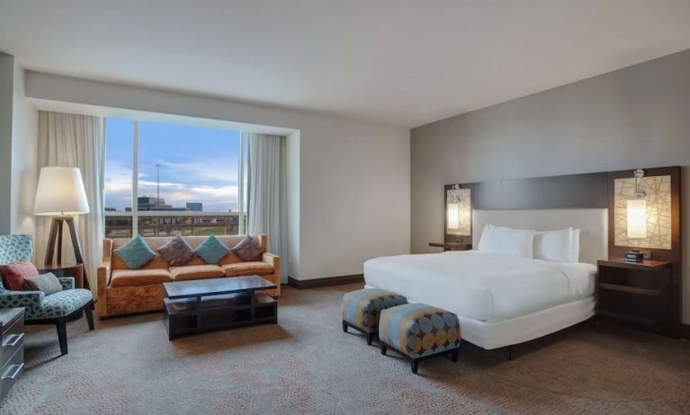 Spacious meeting room with living area at Hilton Dallas/ Plano Granite Park.
