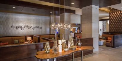 Lobby and coworking lounge at Hilton Dallas/ Plano Granite Park.