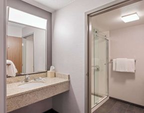 Guest bathroom with shower at Sonesta Select Phoenix Chandler.