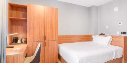 Day use room with work desk and natural light at Liberty View Brooklyn Hotel.