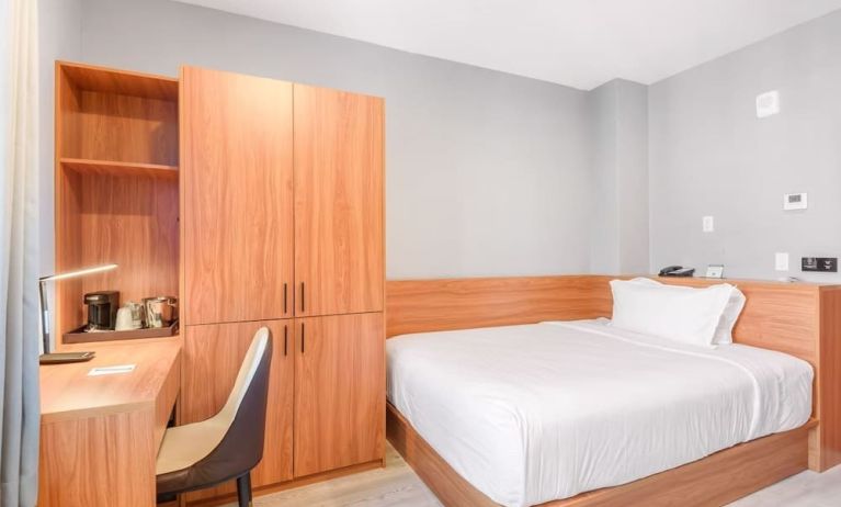 Day use room with work desk and natural light at Liberty View Brooklyn Hotel.