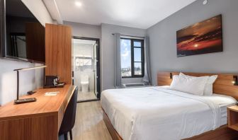 Day use room with work desk and natural light at Liberty View Brooklyn Hotel.
