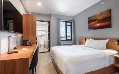 Day use room with work desk and natural light at Liberty View Brooklyn Hotel.