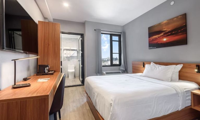 Day use room with work desk and natural light at Liberty View Brooklyn Hotel.