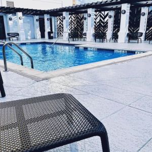Refreshing outdoor pool at The Chifley Houston, Tapestry Collection By Hilton.
