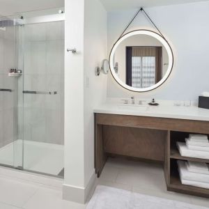 Guest bathroom with shower at The Chifley Houston, Tapestry Collection By Hilton.