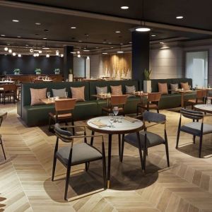 Dining area perfect for coworking at The Chifley Houston, Tapestry Collection By Hilton.
