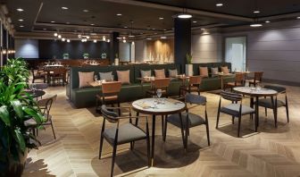 Dining area perfect for coworking at The Chifley Houston, Tapestry Collection By Hilton.