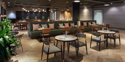 Dining area perfect for coworking at The Chifley Houston, Tapestry Collection By Hilton.