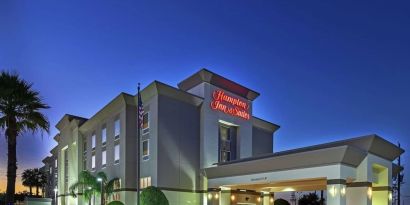 Hotel exterior at night at Hampton Inn & Suites Houston-Bush Intercontinental Aprt.