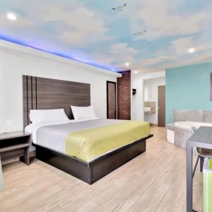 Day use room with TV at Exclusivo Inn & Suites. 