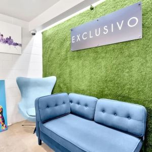 Lobby seating at Exclusivo Inn & Suites. 