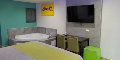 Day use room with TV at Exclusivo Inn & Suites. 
