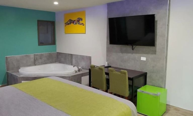 Day use room with TV at Exclusivo Inn & Suites. 