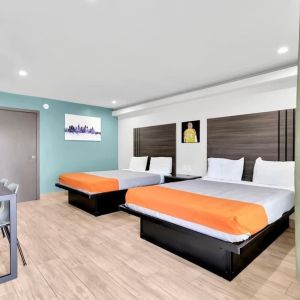 Day use room with TV at Exclusivo Inn & Suites. 