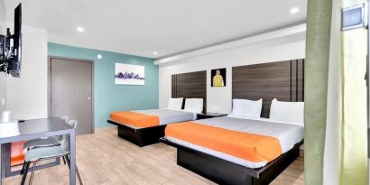 Day use room with TV at Exclusivo Inn & Suites. 