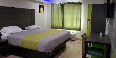 Day use room with TV at Exclusivo Inn & Suites. 