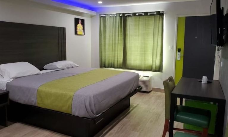 Day use room with TV at Exclusivo Inn & Suites. 