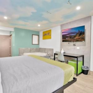 Day use room with TV at Exclusivo Inn & Suites. 