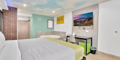 Day use room with TV at Exclusivo Inn & Suites. 
