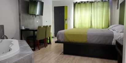 Day use room with TV at Exclusivo Inn & Suites. 