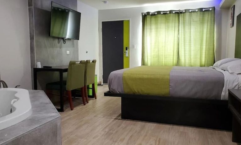 Day use room with TV at Exclusivo Inn & Suites. 