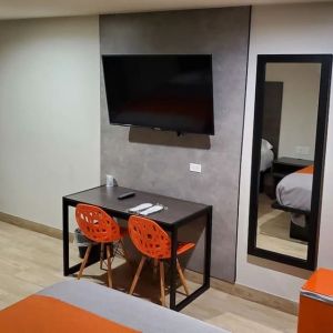 Day use room with TV at Exclusivo Inn & Suites. 