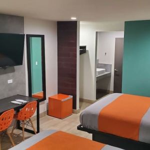 Day use room with TV at Exclusivo Inn & Suites. 