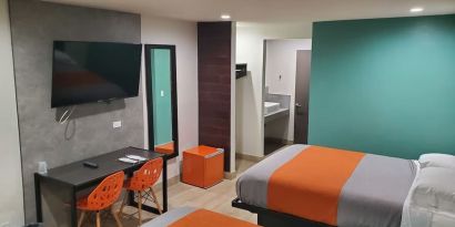Day use room with TV at Exclusivo Inn & Suites. 