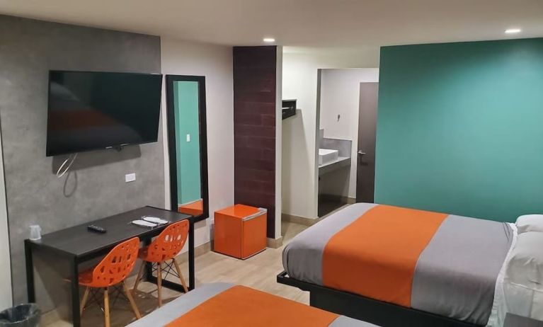 Day use room with TV at Exclusivo Inn & Suites. 