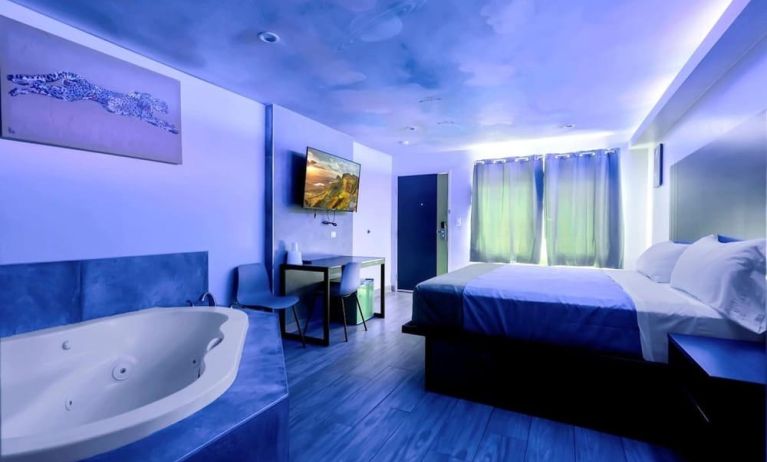 Day use room with TV at Exclusivo Inn & Suites. 