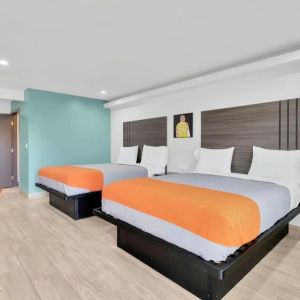 Day use room with TV at Exclusivo Inn & Suites. 