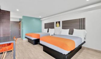 Day use room with TV at Exclusivo Inn & Suites. 