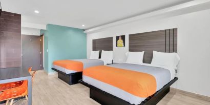 Day use room with TV at Exclusivo Inn & Suites. 