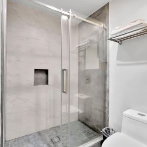 Private guest bathroom with shower at Exclusivo Inn & Suites. 