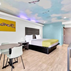 Day use room with TV at Exclusivo Inn & Suites. 