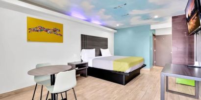 Day use room with TV at Exclusivo Inn & Suites. 
