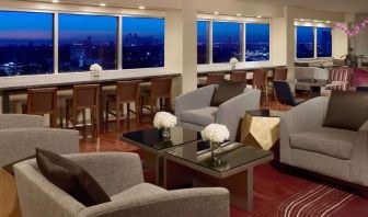Lobby lounge area and workspace at Royal Sonesta Houston Galleria.