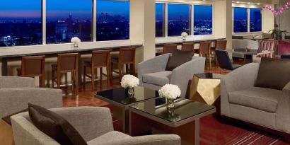 Lobby lounge area and workspace at Royal Sonesta Houston Galleria.