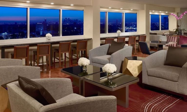 Lobby lounge area and workspace at Royal Sonesta Houston Galleria.