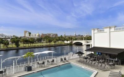 Outdoor pool with lounge area at Hotel Tampa Riverwalk.
