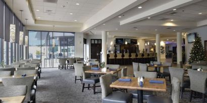 Dining area with comfortable seating at Hotel Tampa Riverwalk.