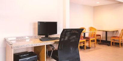 Business center with computer, printer and ergonomic chair at Hotel Inn Milwaukee.