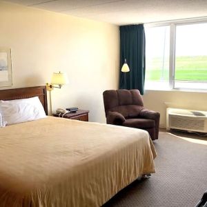 Bright and spacious day use room with work desk and sofa at Norwood Inn And Suites Worthington.