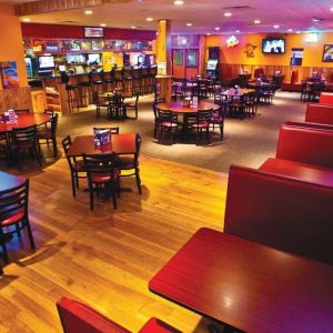 On-site bar and seating area at Norwood Inn And Suites Worthington.