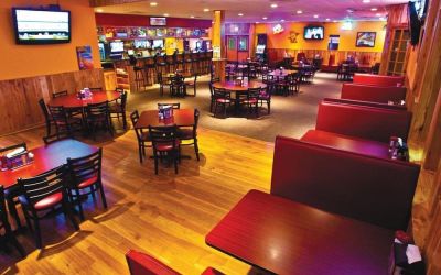 On-site bar and seating area at Norwood Inn And Suites Worthington.