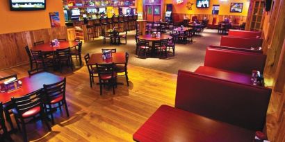 On-site bar and seating area at Norwood Inn And Suites Worthington.