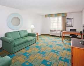 Day use suite's workspace and living area at Norwood Inn & Suites Merrillville.